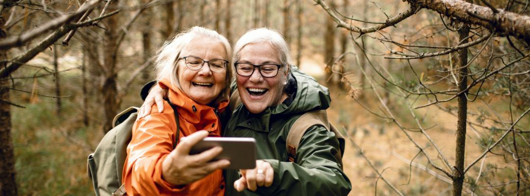 Two people taking a Selfie in the woods